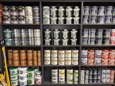 Shelf of various stains on display at Larry's Carpet One. 